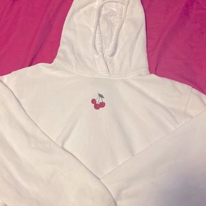 It’s a cropped hoodie (white ) with a cherry in the middle (small)